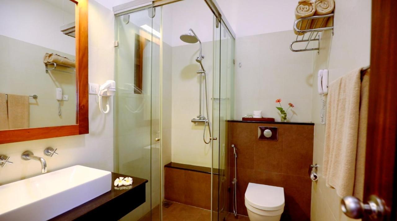 Suite with a glass of traditional lassi overlooking paddy fields, and enjoy tea or coffee with evening snacks