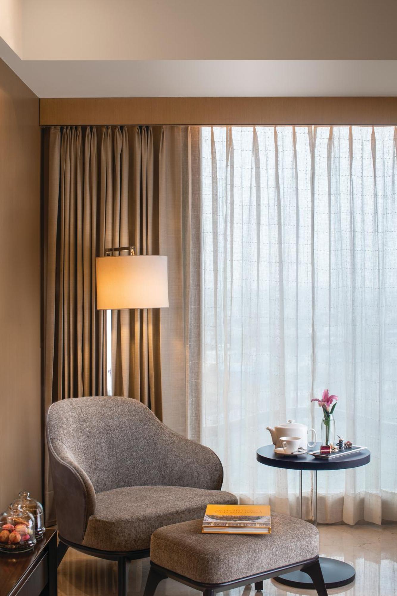 Executive Room with alcoholic / non - alcoholic house drinks , a platter of Fruits and Cookies , 01 way airport transfers, 10% off on food & soft beverages, complimentary sauna and steam once during the stay