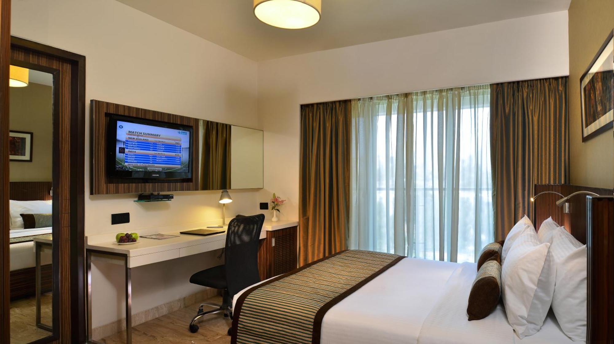 Deluxe Room 1 Double Bed with 15% off on Food & Beverages Services and 10% off on Two way Airport Transfer and Laundry Services