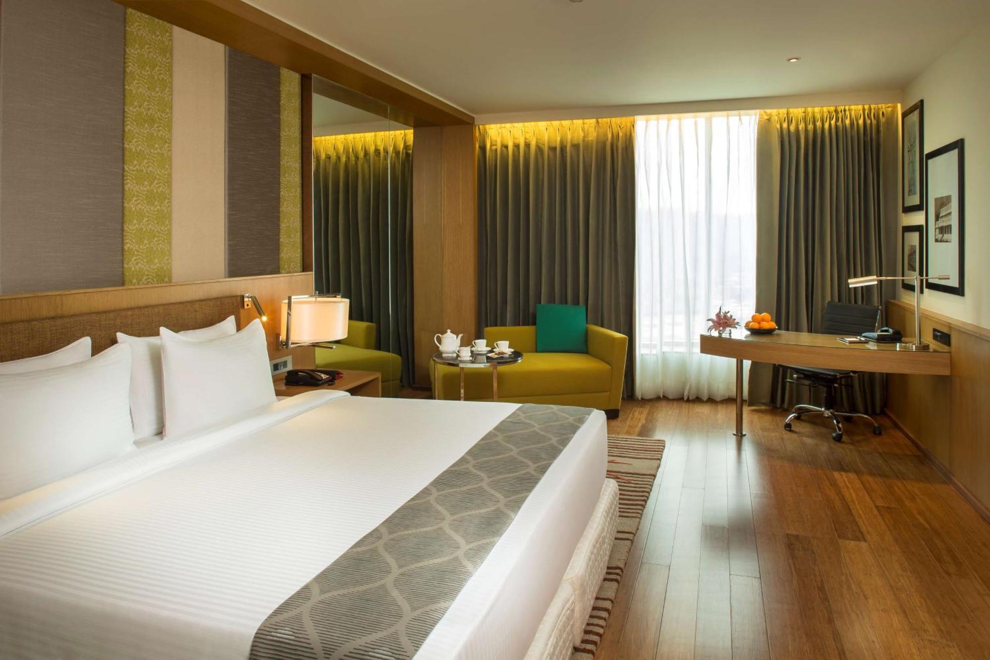 Business Class Room with Bath tube with Complimentary One Way Airport Transfer , 20% discount on Laundry Services , 15% of on Food & Soft Beverages and Complimentary In-Room Refreshments with Cookie Platter provided one per stay