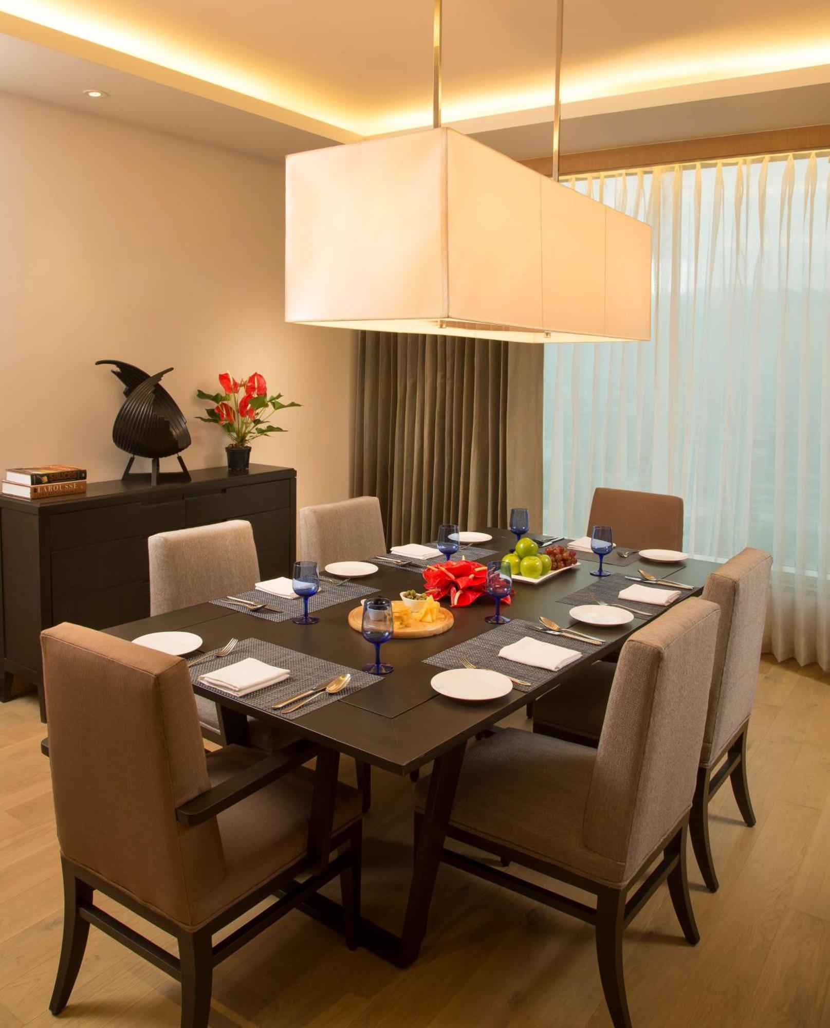 Suite Bedroom with separate living room & bed room with King bed, Bath tub , 2 way airport transfer, bottle of complimentary House wine , 15% discount on Food & Soft Beverages and Pick up and drop from Kamakhya Temple