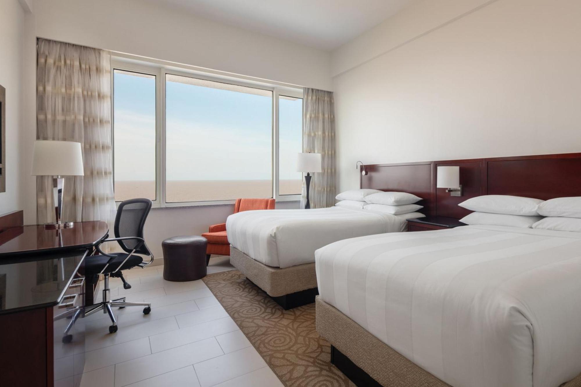 Deluxe Guest Room with Two Double Beds and Ocean View
