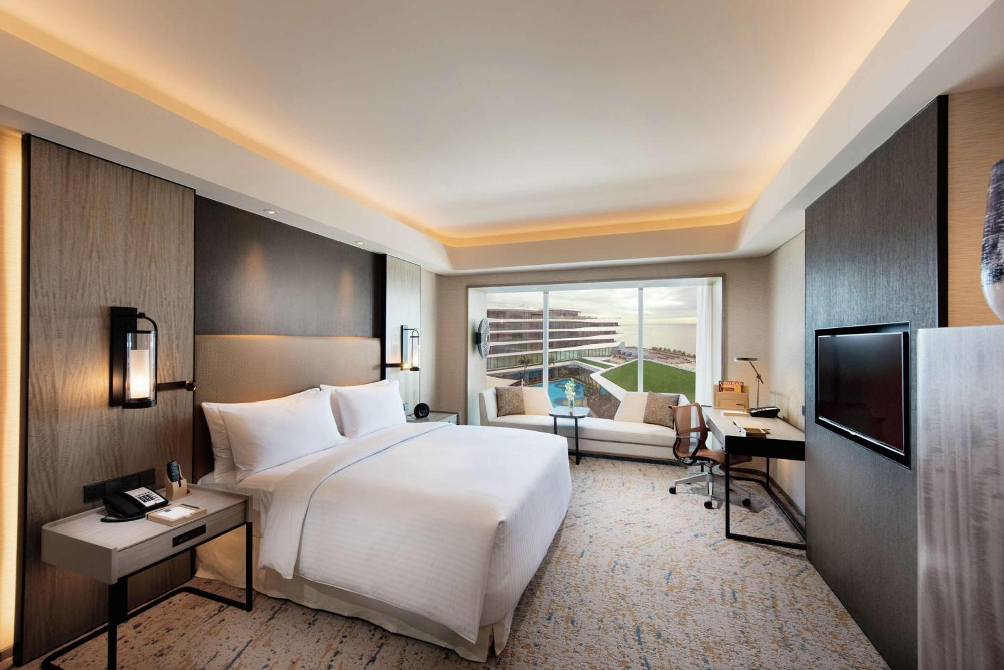Deluxe King Room with Pool View and Partial Bay View