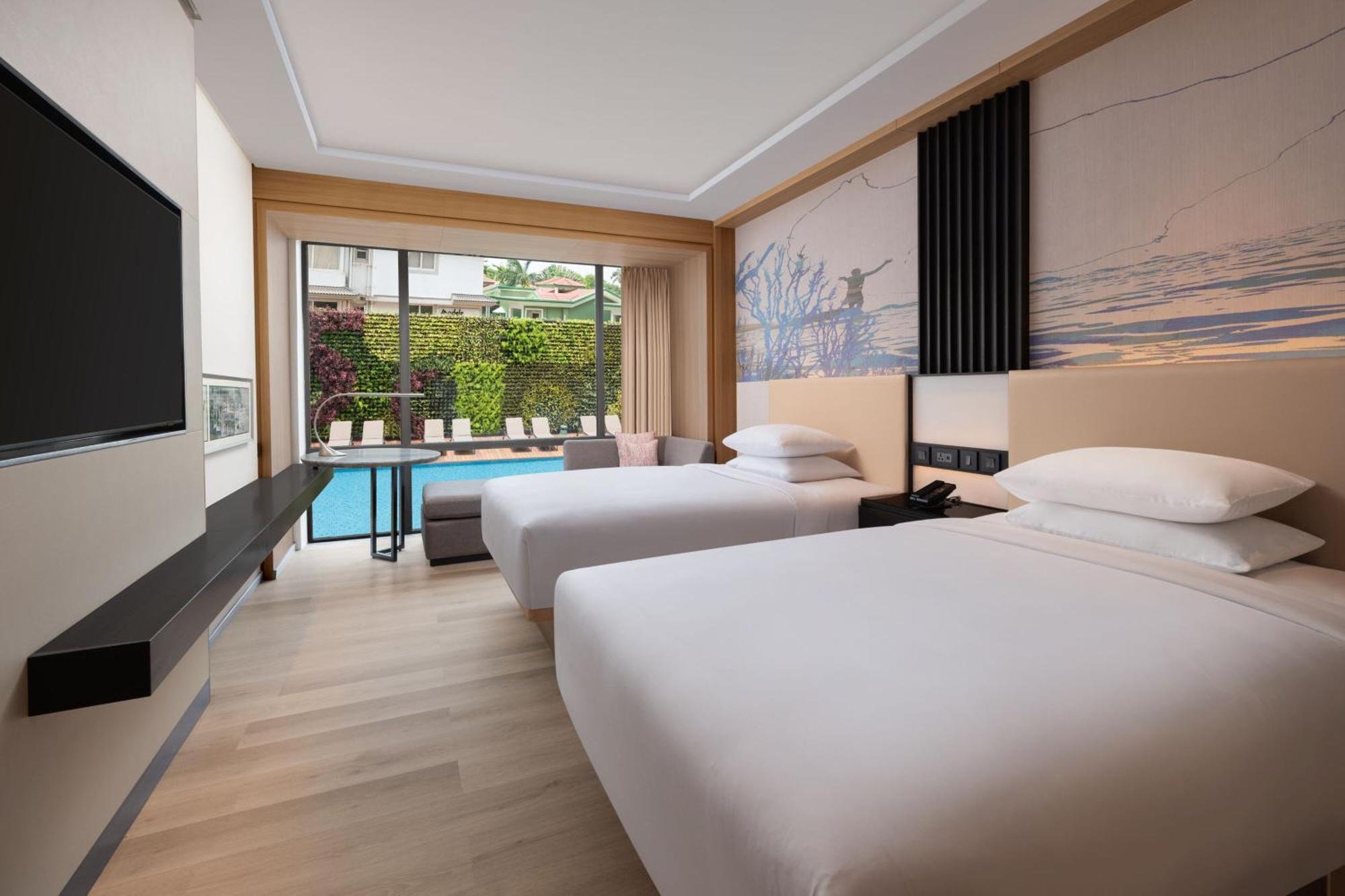 Deluxe Guest room, 2 Queen, Partial pool view with INR 500 Spa credit on minimum therapy of 60 mins per stay