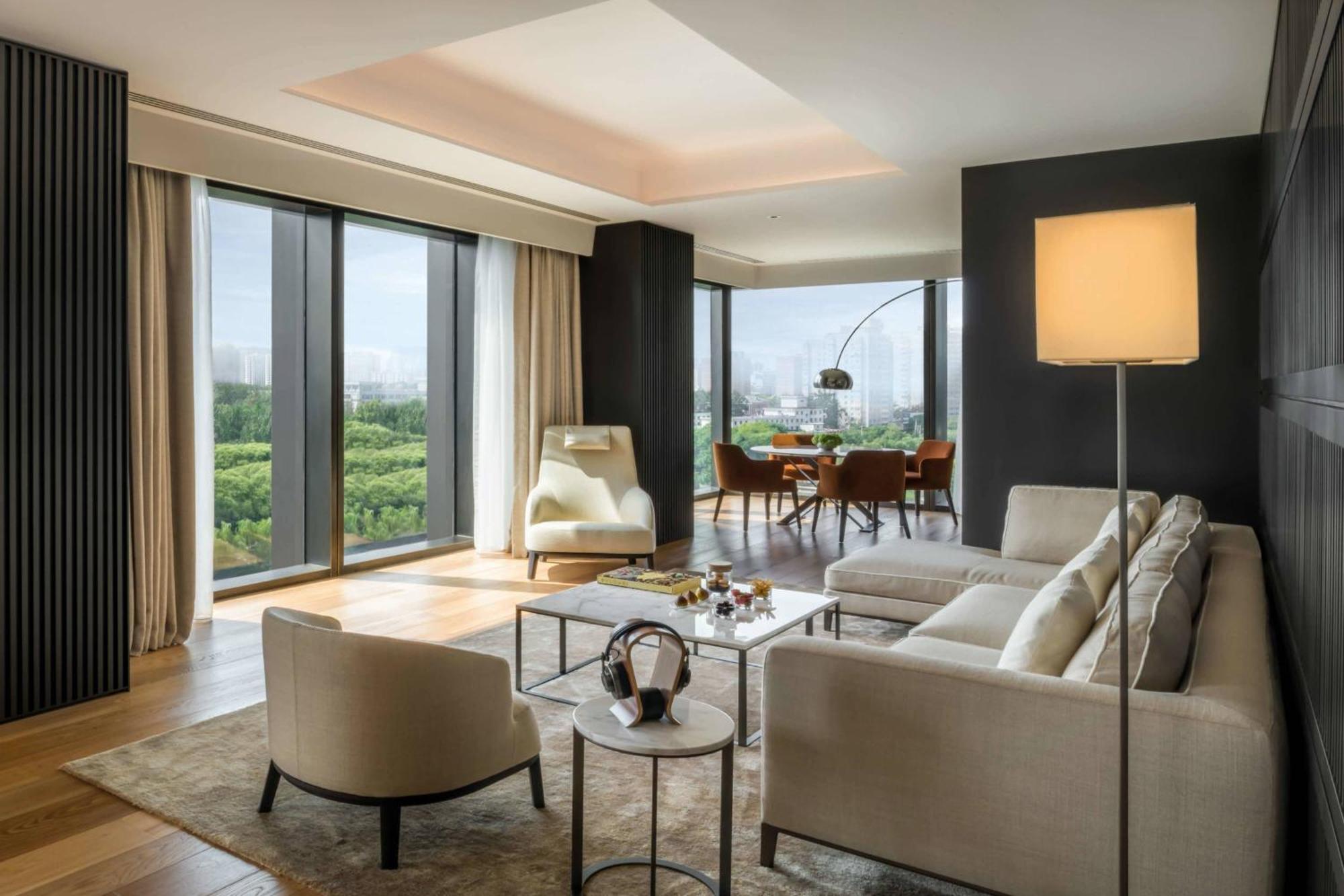 One-Bedroom Deluxe Suite with Liangma River View (Free Mini-bar soft drinks & beers + Two-way limousine services are available between the hotel and airport or train station in Beijing + unlimited laundry service)