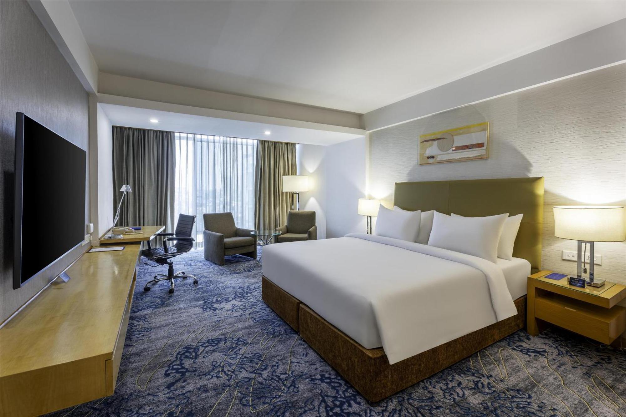 Business Double Room with Complimentary 2 IMFL Drinks and 2 Pieces of Laundry per stay