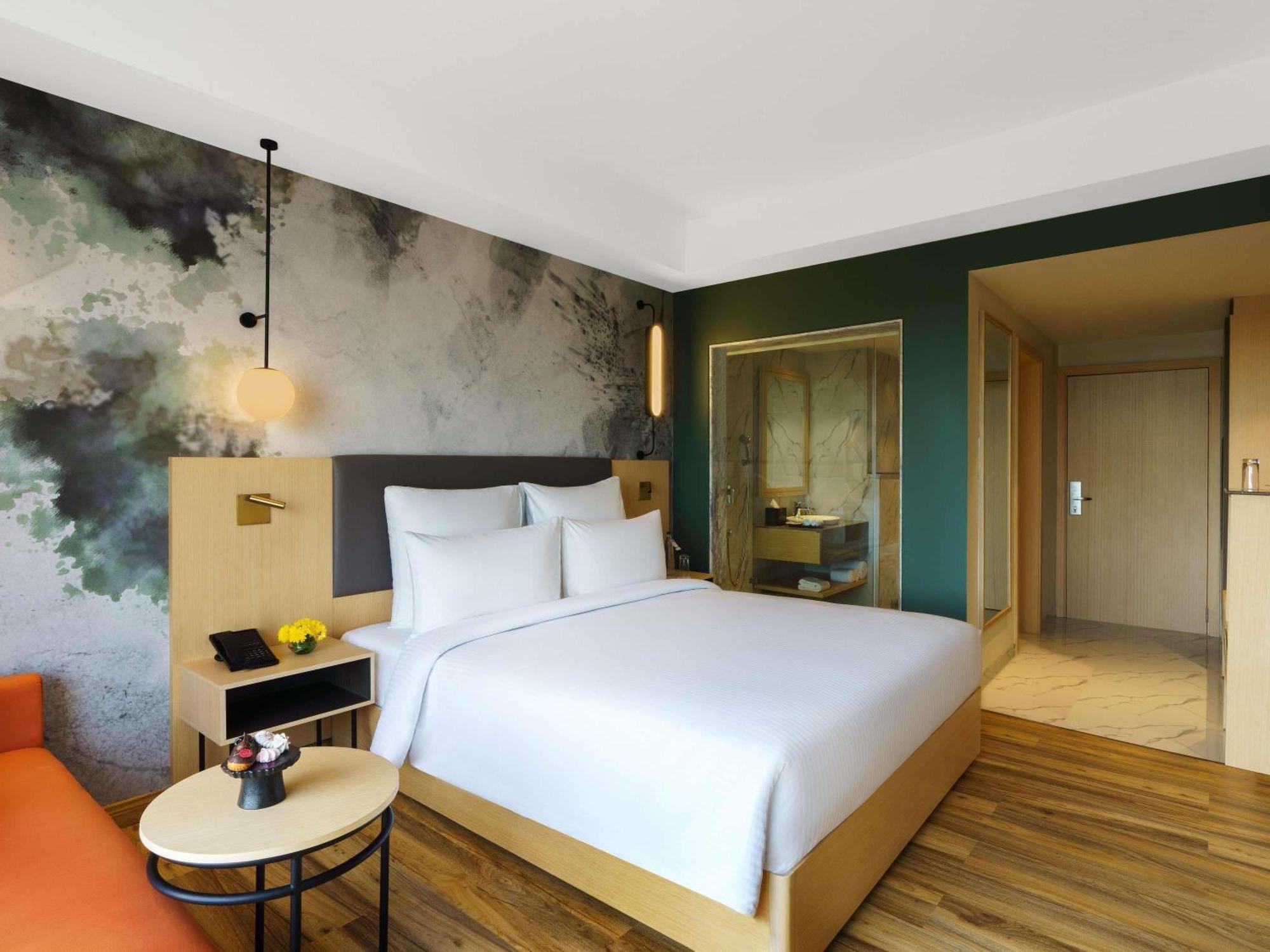 Executive Suite with One Double Bed - Non Smoking/City Side: Unlimited premium brands (6 to 8 PM) daily *, 1+1 on drinks (11 AM-7 PM), 15% Off on SPA, 15% off on Food and Soft Beverages, Free Gaming Zone access, Complimentary coffee&Tea (6AM-8 PM)