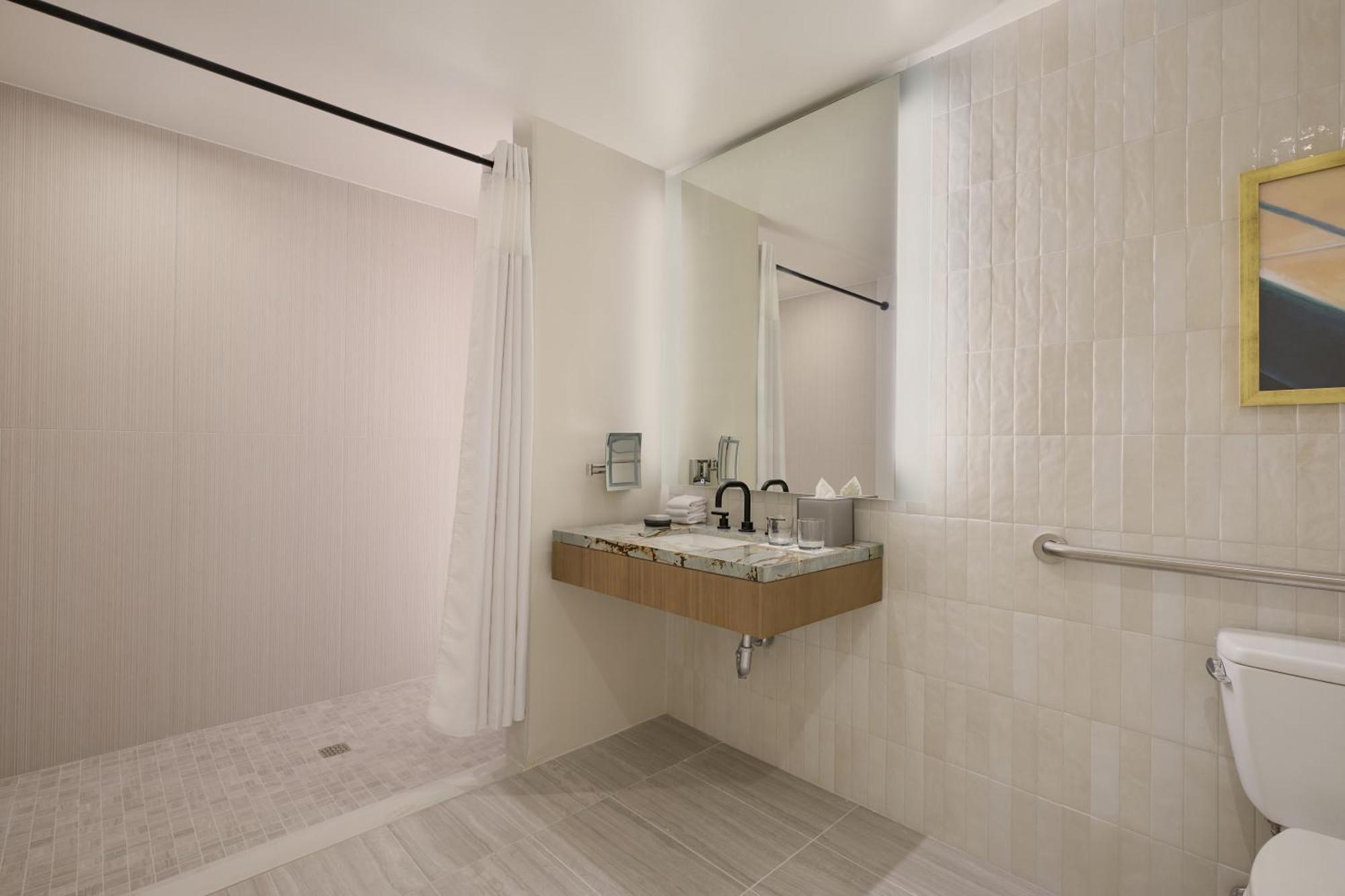 Deluxe King Room Roll Shower Mobility Hearing Accessible,1769514790:JPEG