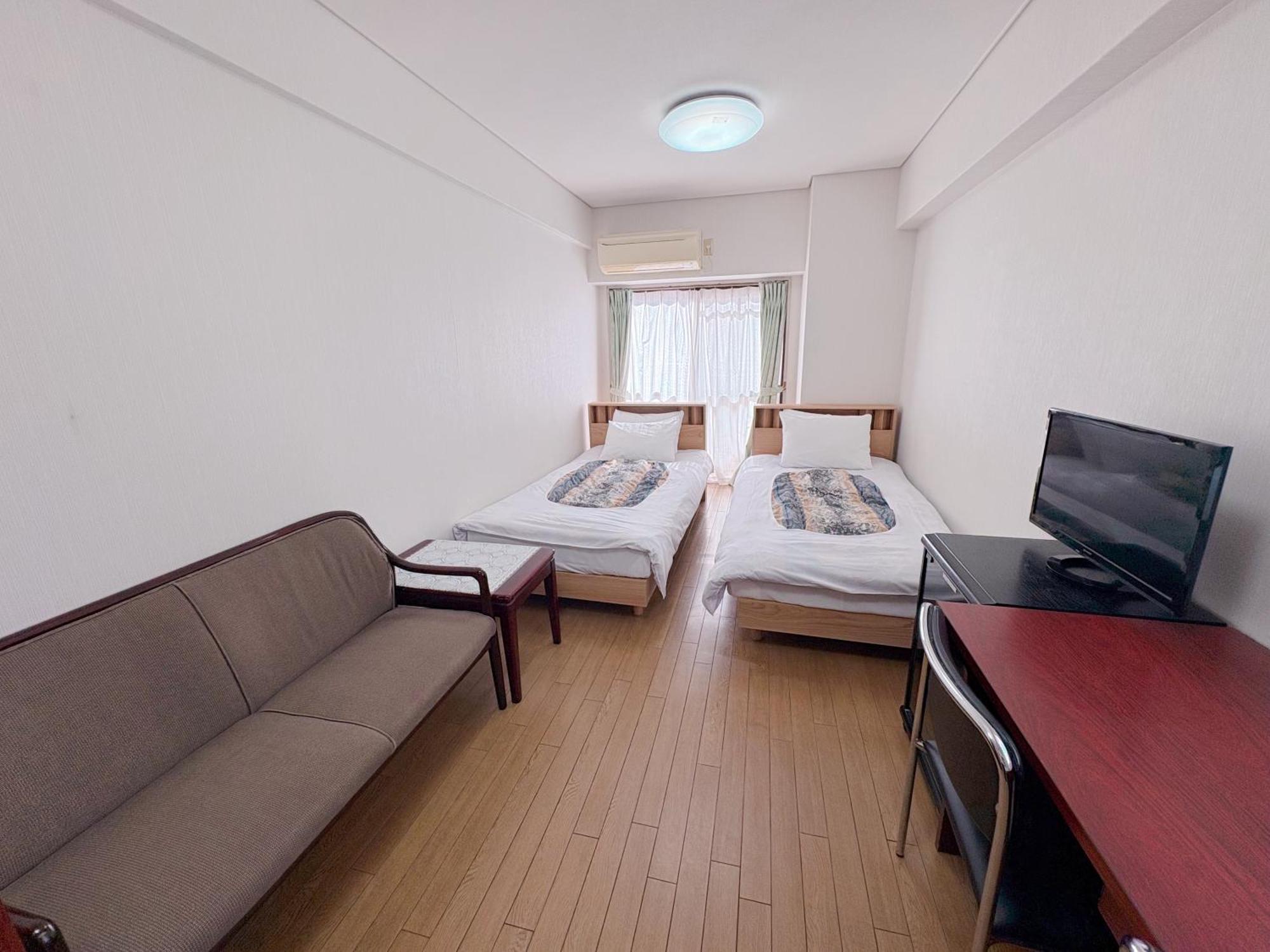 Standard Twin Room with Sofa - Non-Smoking