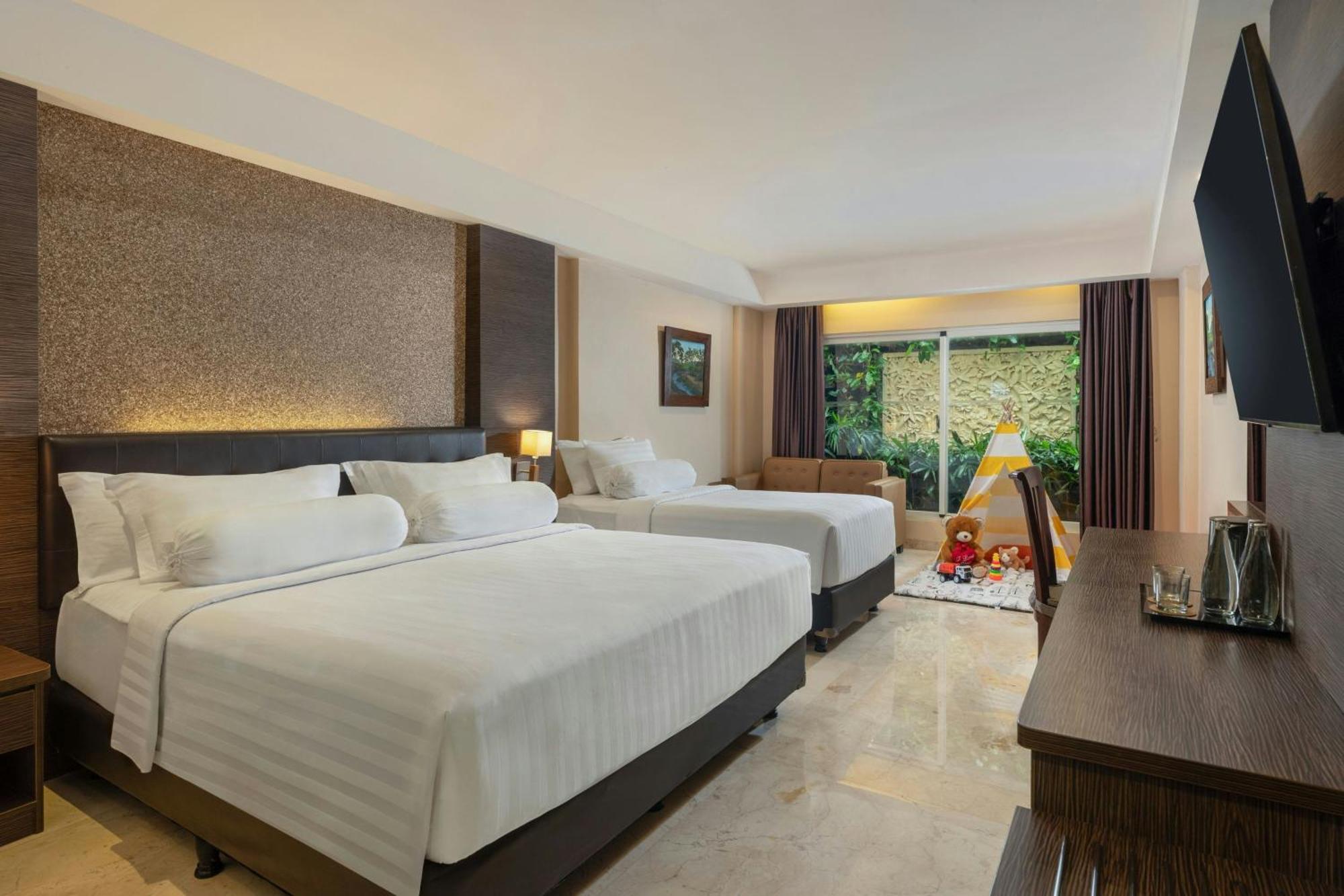 Deluxe Family King Room, with FREE daily shuttle to Ubud City, FREE Photo Session, FREE Art Gallery Visit, 24-hour access to Fitness Center, FREE Welcome Drink, and FREE Kids Activities.