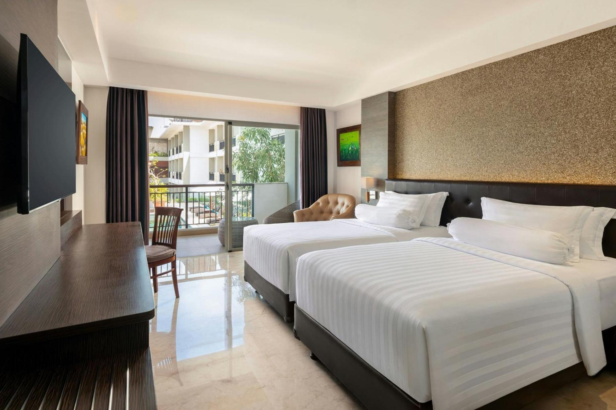 Deluxe Twin Balcony Room with Pool View, with FREE daily shuttle to Ubud City, FREE Photo Session, FREE Art Gallery Visit, 24-hour access to Fitness Center, FREE Welcome Drink, and FREE Kids Activities.