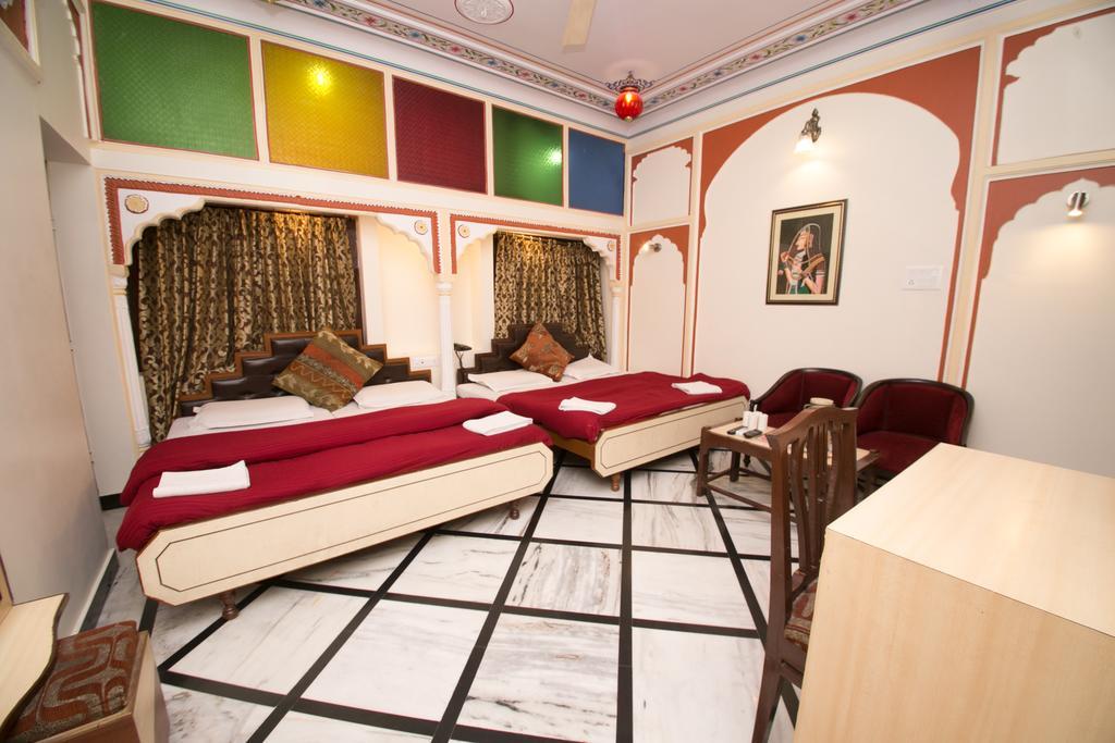 Family Room with fan (4 Adults) - 10% off on SURA Cocktails & Cuisines, Enjoy Live Music, Welcome Drink on Arrival and Free Pickup from Railway Station