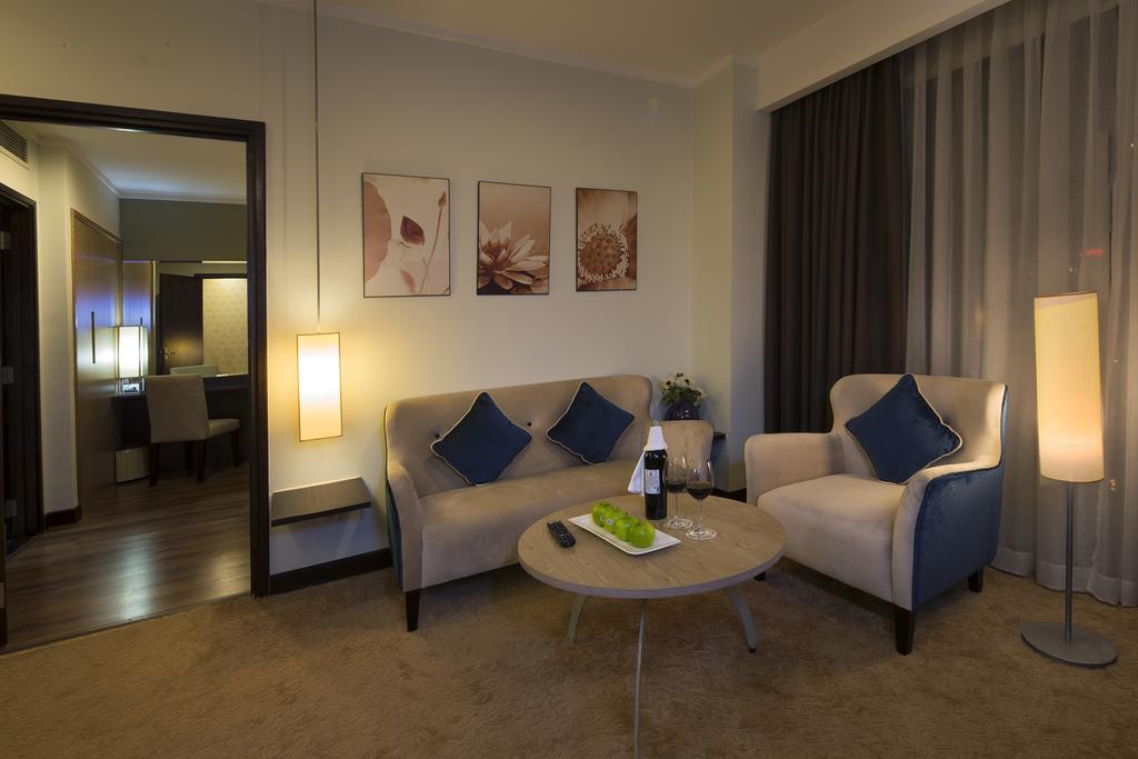 Deluxe Suite Triple with balcony and city view