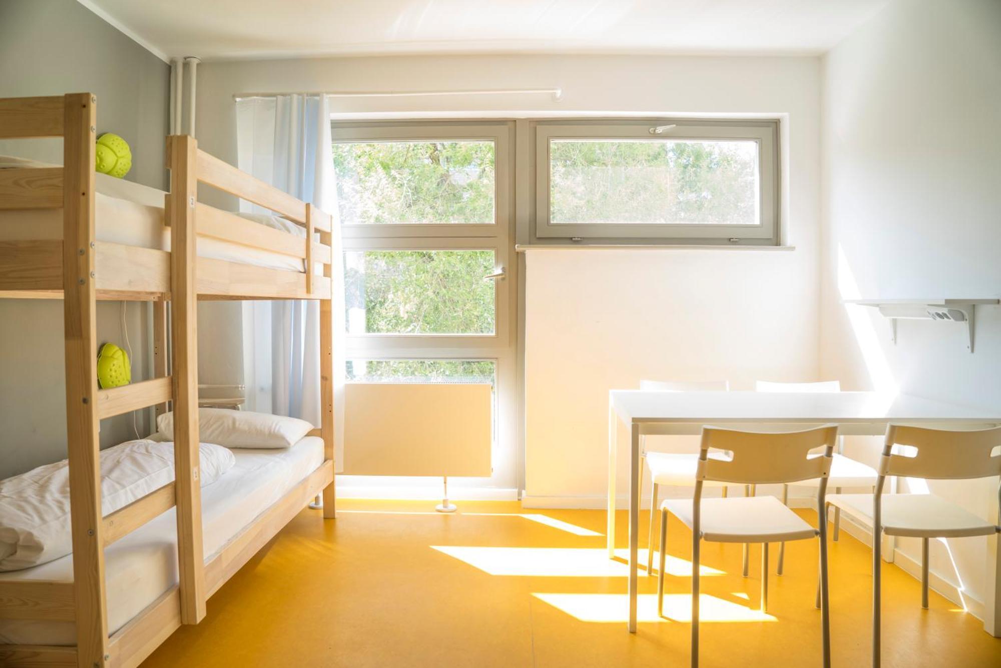 Bed in 4-Bed Dormitory Room with Shared Bathroom