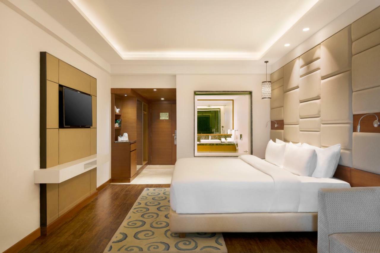 Junior Suite: (2 Way Airport Transfer, 20% off on SPA, laundry, INR 500 F&B credit, Fruit basket on the day of arrival, 4 pcs of Laundry/room/night, One bottle of whiskey/wine as per availability, 2 pints of House Beer once during stay)