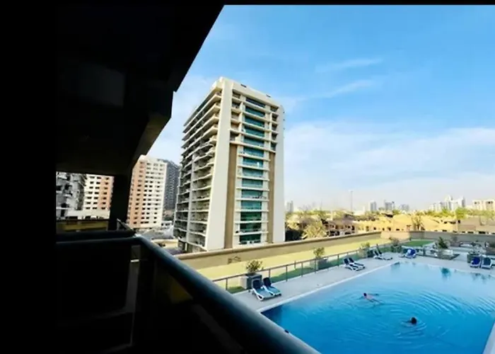 Vogue Vacation Homes, Sports City Elite Near First Avenue Mall, One Bedroom Apartment With Balcony And Vibrant Community View, Access To All Amenities Dubai